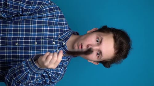 Young Adult Combs Dark Hair