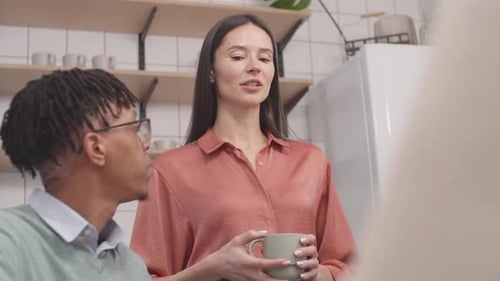 Relaxed Chat Between Friends in Modern Kitchen