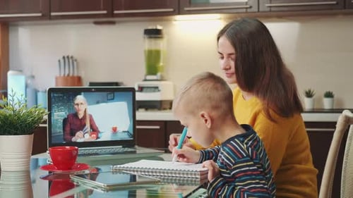 Mother and Child Doing Schoolwork on Video Call