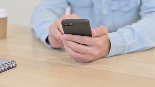 Close Up of Smartphone Use By Man Browsing Internet