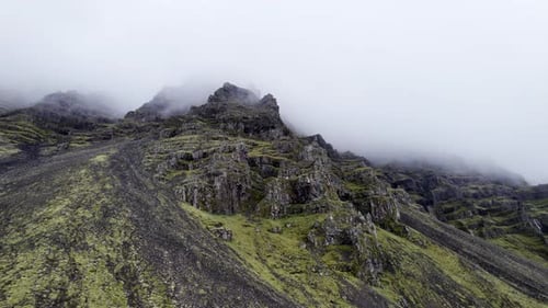 Drone Flight From Mountain Peak In Mist