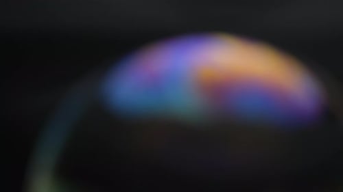 Soap bubbles isolated on black background. Abstract soap bubbles with colorful reflections.