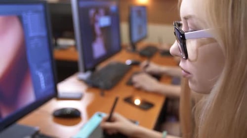 Young Designer Working with Tablet in Modern Office