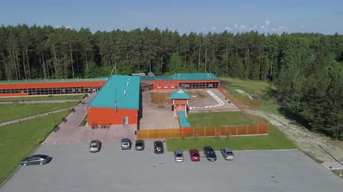 Aerial view of Recreation center with guest rooms and a pool on the street 01