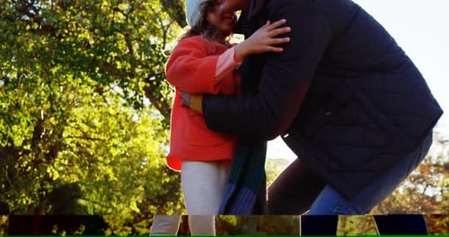 Child Runs to Embrace Parent in Sunny Park