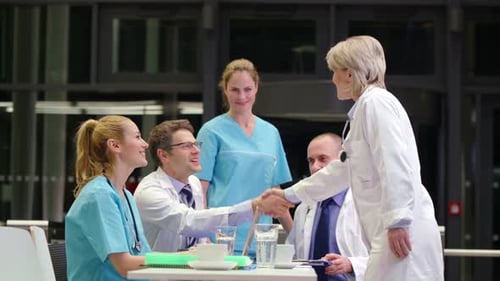 Medical Professionals Collaborate at Hospital Meeting