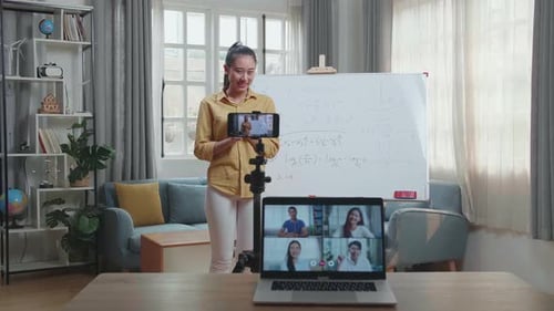 Young Woman Teaching Math Online From Home