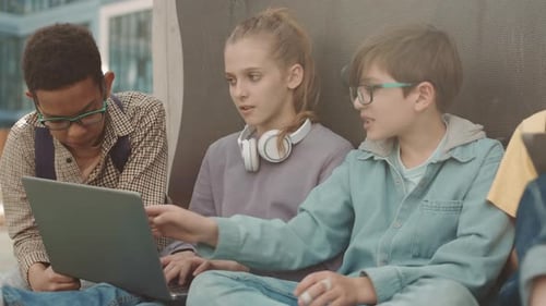 Children Preparing School Project on Laptop Outdoors