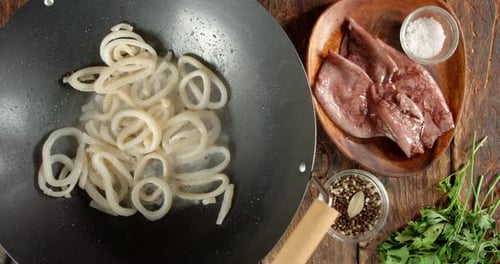 Overhead Shot of Squid Rings Cooking in Wok
