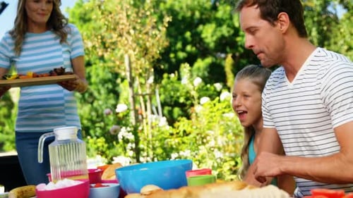 Family having meal in the house garden