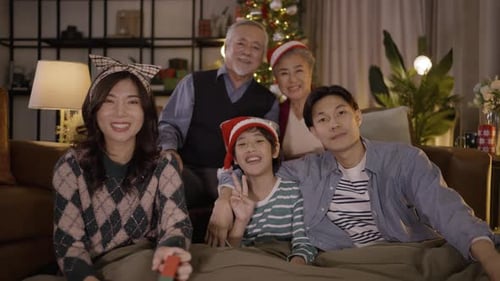 Multigenerational Family Smiles at Christmas Portrait