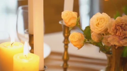 Romantic Table Setting with Candles and Flowers