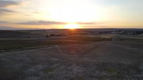 Golden Sunrise Over a Quiet Rural Landscape
