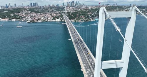 Istanbul Bosphorus Bridge and City Skyline in Background with Turkish Flag at Beautiful Sunset