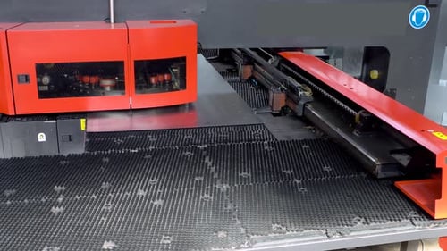 Industrial Machine Punching Holes in Metal Sheet