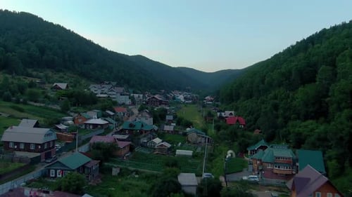 Flight Over the Village Between the Forest Hills