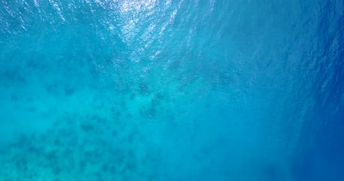 Luxury overhead abstract view of a sandy white paradise beach and aqua blue ocean background