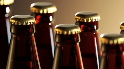 Two rows of brown beer bottles in a closeup view. Endless, seamless loop. 4K HD