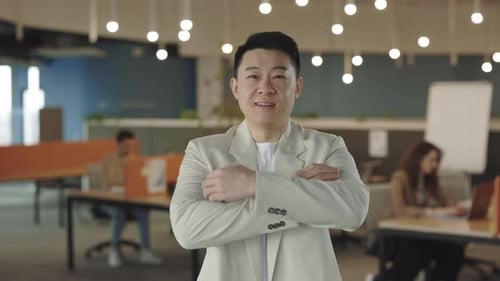 Smiling Young Adult Portrait in Contemporary Office Space