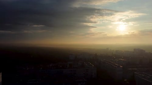Sunrise in city with epic clouds, fog, sun shine