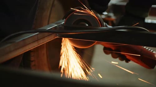 Sparks Flying While Grinding Metal at Night