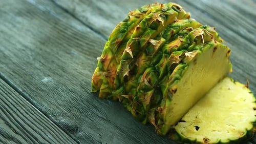 Sliced Pineapple Close Up on Wood Surface
