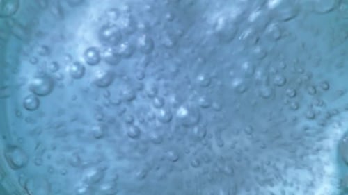 Bubbles Rising in Blue Tinted Water
