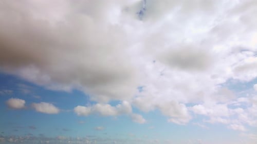 Aerial View of Fluffy Clouds in the Blue Sky