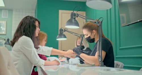 Professional Manicure Studio Beautiful Girls Masters Do Manicure to Clients