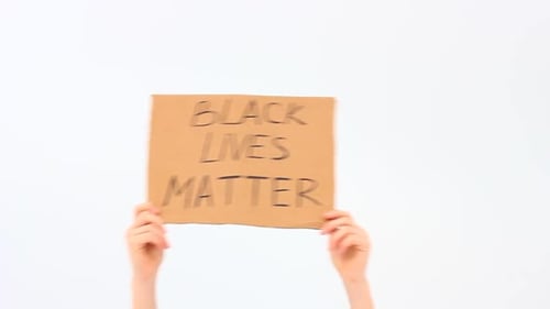 Hands Hold Black Lives Matter Protest Sign