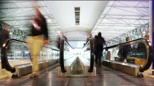 Time Lapse of People on Moving Walkways