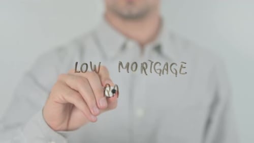 Man Writes Low Mortgage Rates on Glass Surface