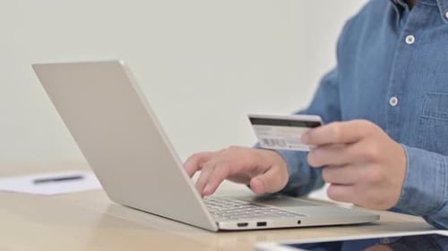 Close Up of Online Payment By Man on Laptop
