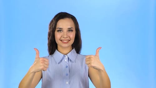 Cheerful Woman Gives Two Thumbs Up Gesture