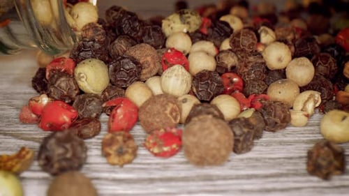 Assorted Peppercorns Macro Shot on Wooden Table