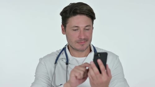 Doctor Using Mobile Device in Studio Setting