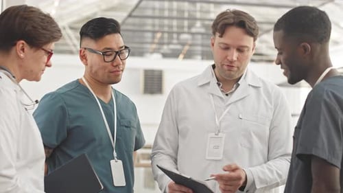 Medical Workers Having Conversation in Clinic