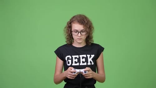 Teenage Girl Playing Video Game on Green Screen