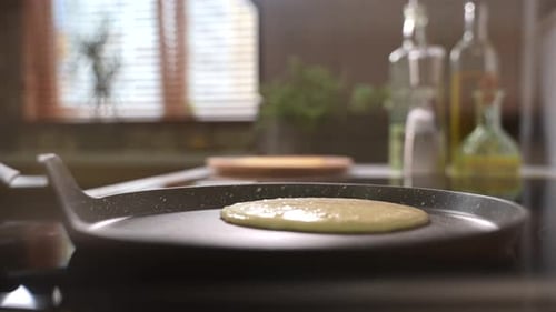 Making pancakes in a bright kitchen with natural light