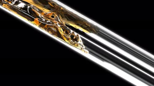 Dynamic Golden Liquid Flowing Through Transparent Tube