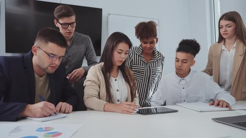 Business Team Meeting Around Conference Table