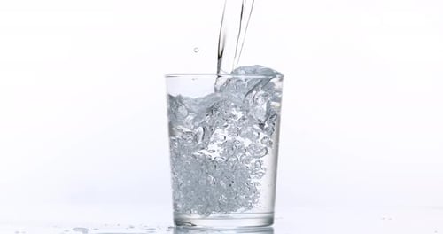 Water Being Poured into a Glass Cup