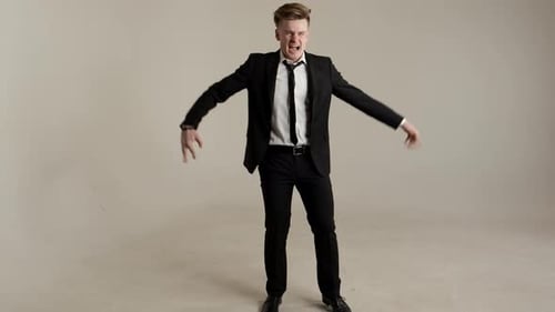 Man in Suit Yelling and Gesturing