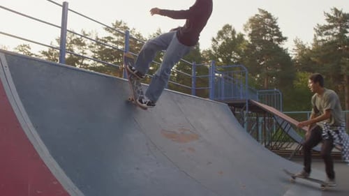 Teenagers Skating on Ramp