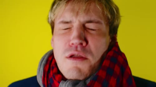 Adult Experiencing Cold or Allergy Symptoms Close Up