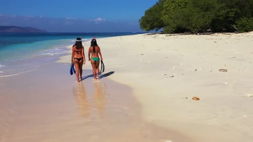 Beautiful women tan on marine seashore beach voyage by turquoise ocean with white sandy background o