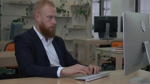 Man Focused at Work in Office