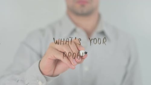 Man Writes "What's Your Problem?" on Glass