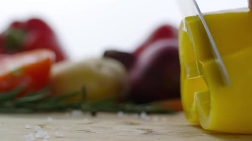 Slicing Yellow Pepper, Vegetables on Cutting Board