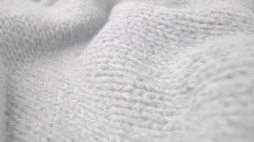 Extreme Detail View of Sheep Wool Cloth Texture Flowing in Macro Dolly Shot
